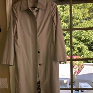 Woman’s light gray long trench coat